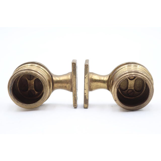 Reclaimed towel bar brackets made of brass with a polished finish. It is compatible with a round bar with 1 in. diameter....