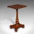 This is an antique calligrapher's extending table. An English, mahogany cantilever chairside or wine table, dating to the...