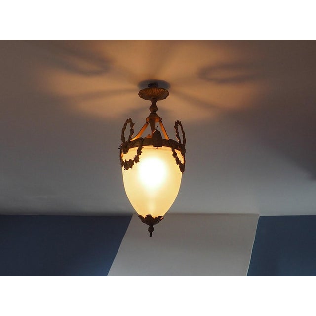 Antique French Louis XVI Style Glass and Bronze Pendant Lamp, 1890s, in Very Good conditions. Designed 1890 to 1919 Up to...