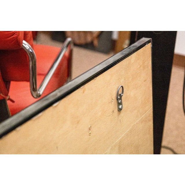 A contemporary modern “Harvard Reflections” sculptural mirror. Circa 1980s. An intricate design showing a fanciful...