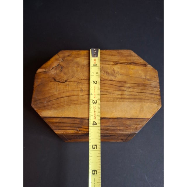 This exceptional early 20th-century octagonal Etrog box is hand-carved from highly figured, beautifully grained Holy Land...