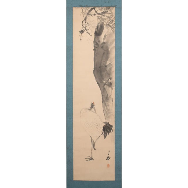 Fine large antique Japanese monochrome watercolor scroll painting depicting Red-Crowned Crane standing near a big Plum...