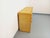 Vintage 1970s sideboard in rattan and woven rattan, offering ample storage: 4 doors with 1 large interior shelf, 3...