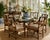 A handsome set of six authentic McGuire dining armchairs, showcasing the California maker’s iconic blend of organic...