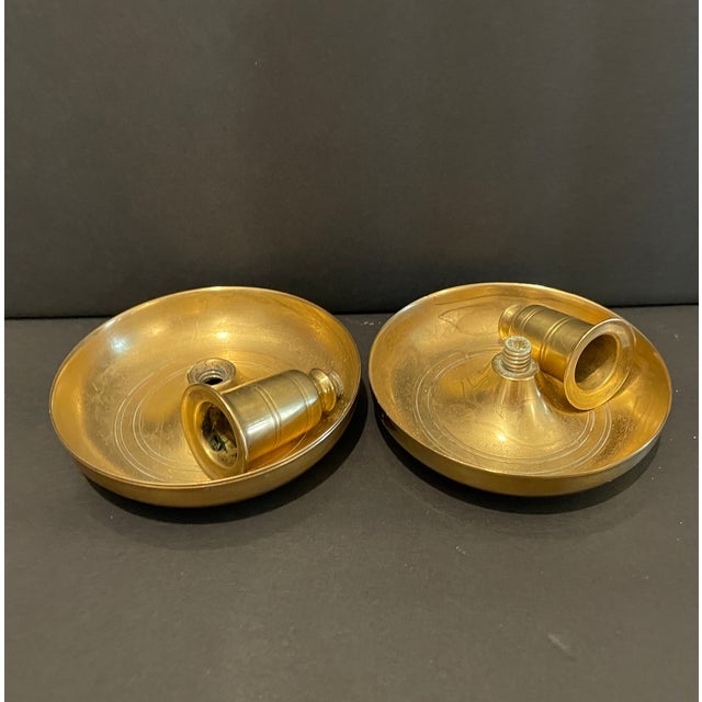 Set of heavy brass Brighton Bun candlesticks reproduced by Virginia Metalcrafters for Colonial Williamsburg Restoration....