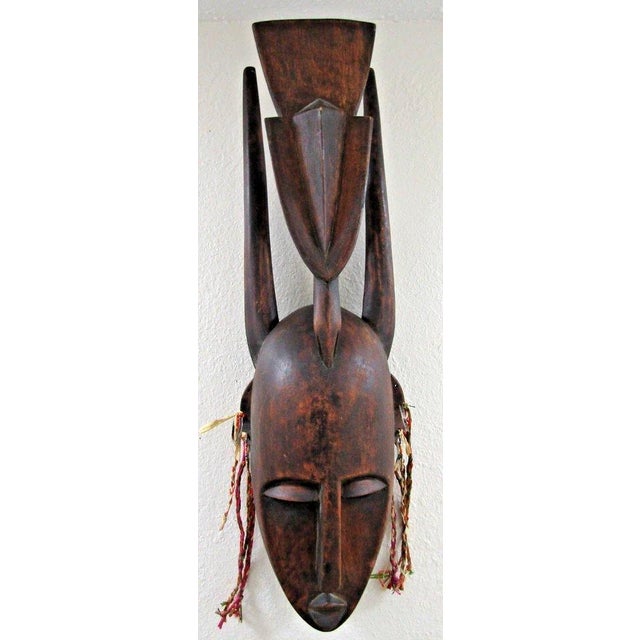 Authentic Large Hand-Carved Wooden Bamana N'tomo Mask from Mali, West Africa Measures 11" wide, 8" deep and 34" tall. The...
