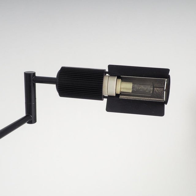 The haloprofil 878hr floor lamp in matte black bring a piece of swiss precision and 1970s architectural flair into your...