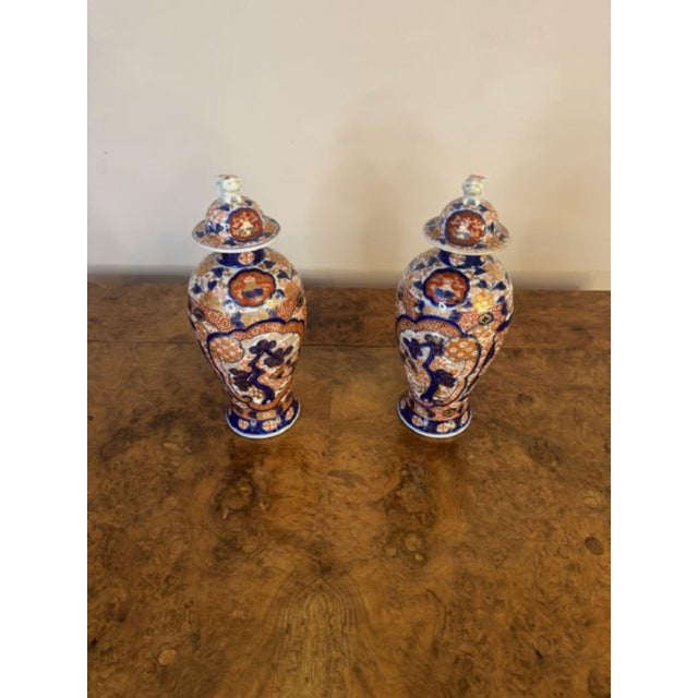 Fine quality pair of antique 19th century Japanese imari porcelain lidded vases, having a fine quality pair of late 19th...