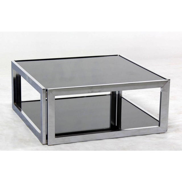 Mid century modern two tier square chrome and smoked glass coffee table in style of M. Baughman.