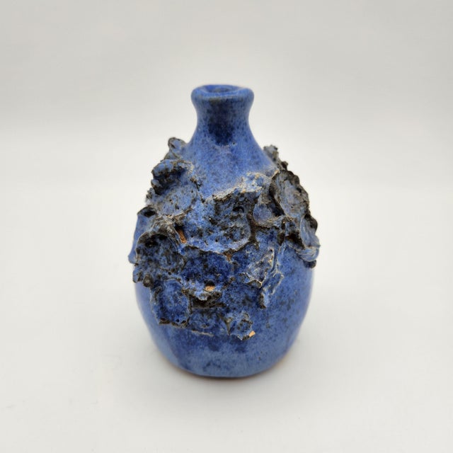 Studio pottery weed pot in mottled cobalt-blue glaze with sculptural applied floral relief, signed and marked "St. Albans,...