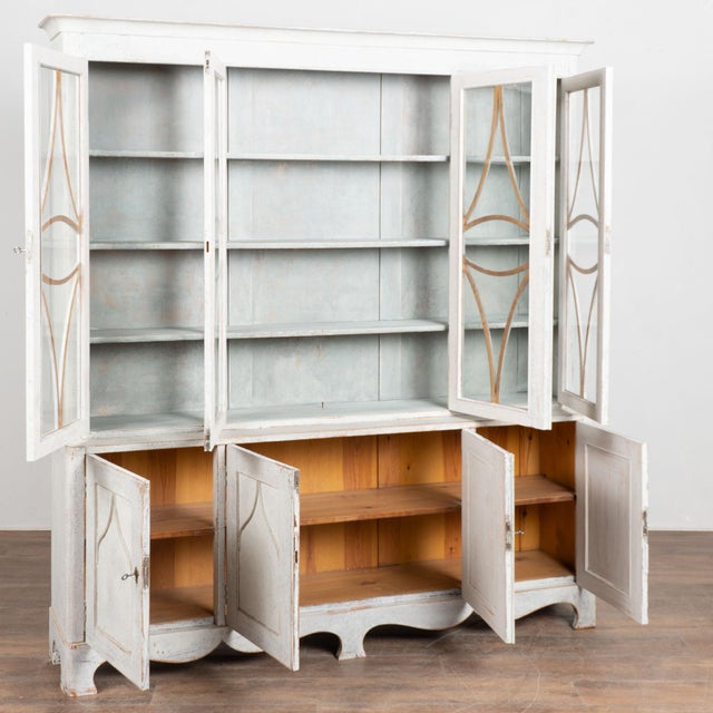 Elegant and stately Swedish Gustavian style display cabinet or bookcase in two sections standing over 6' tall and just...