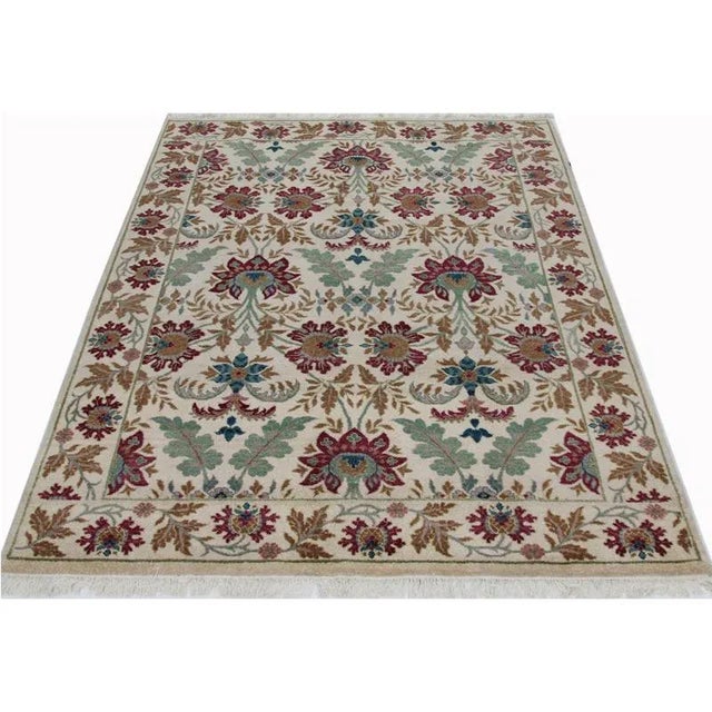 This beautiful handwoven European style rug features an elegant all-over Spanish design on a lush solid beige-colored...