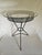 An MCM Atomic Tripod Hairpin Wrought Iron and Glass Side Table, Featuring great retro styling on a sturdy table with...