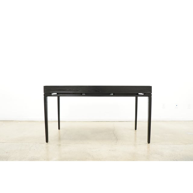 The Brock Writing Desk offers a refined interpretation of modern classic design, combining sleek lines with a rich hand-...