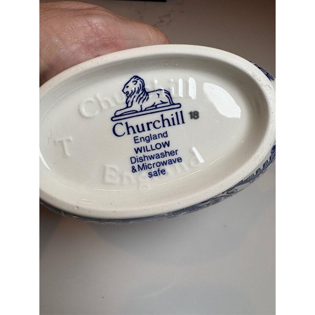 Enhance your dining table with this Churchill Blue Willow gravy boat. Expertly crafted in Staffordshire, England, this...