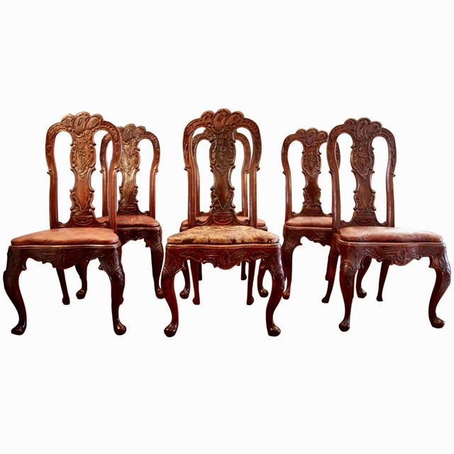 A remarkable set of antique Rococo carved walnut dining chairs, designed with bold curves and great details. Cabriole legs...