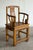 A Chinese southern official's hat armchair (nanguanmaoyi) in pale golden elm, with a gently curved crest rail, S-curved...