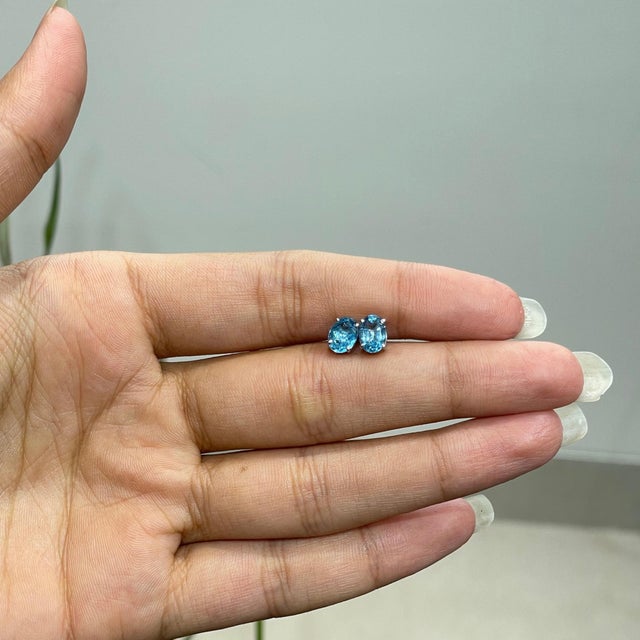 Classic 5x7mm Oval Blue Topaz Four Prong Stud Earrings in 925 Sterling Silver - A Pair For Sale - Image 6 of 13