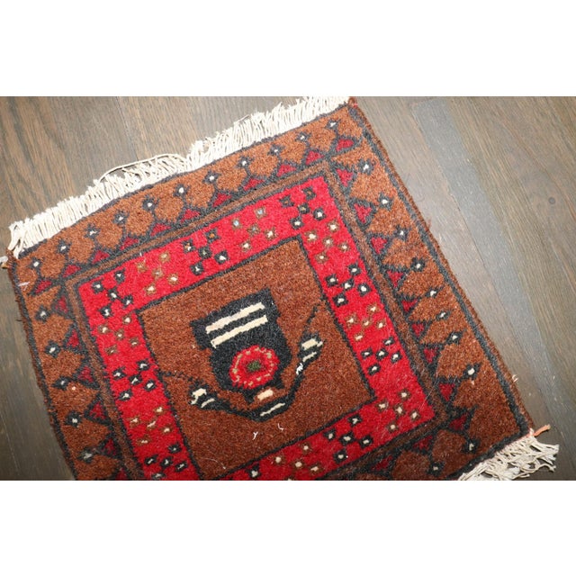 a 3rd quarter of the 20th century Bokhara Rug depicting a telephone