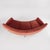 Three-seater sofa in deep coral velvet, with a curved, enveloping silhouette. Slightly sloping backrest, rounded, soft...