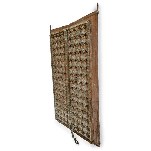 Beautiful antique bronze metal work door from North India. Traditional Mogul style exquisite details in the engraved brass...