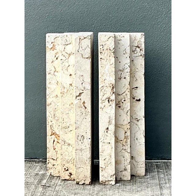 This pair of table pedestals is carved from natural coquina stone, a fossilized shell-and-coral aggregate that gives each...