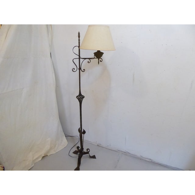 This iron floor lamp uses a an Edison base bulb up to 100 Watts. It is shown with a shade that measures 13" Diameter x...