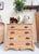 This 4‑drawer antique scrubbed pine chest is a study in early craftsmanship and quiet, enduring beauty. The surface has...