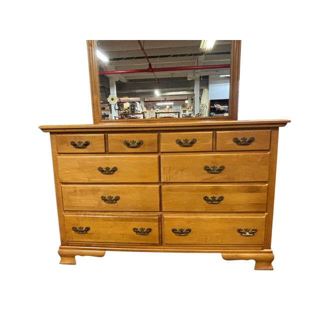 Crafted from solid maple by Forest Furniture, this beautifully constructed nine-drawer dresser offers classic American...