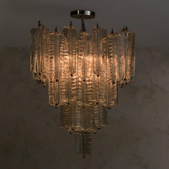 Hand-pulled Murano glass forms the foundation of this 1960s chandelier, attributed to Toni Zuccheri for Venini—each...
