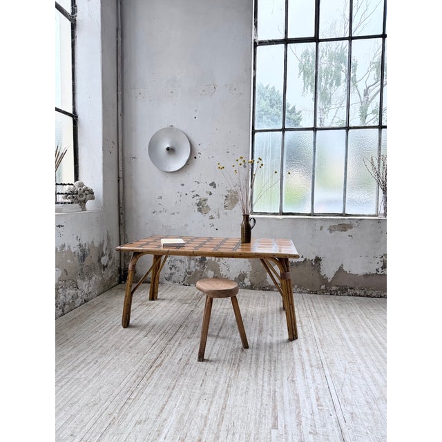 Vintage outdoor rattan table with a ceramic top. We love the tabletop's distinctly vintage design, with its brown...
