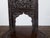 An Anglo-Indian accent side chair circa 1900 with abundant and richly hand-carved floral motifs, scrolling foliage,...