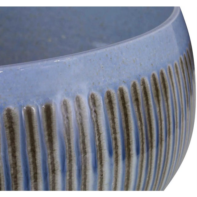 This oversized bowl works well as a centerpiece on a kitchen island, cocktail table, or console. Its unique pattern is...