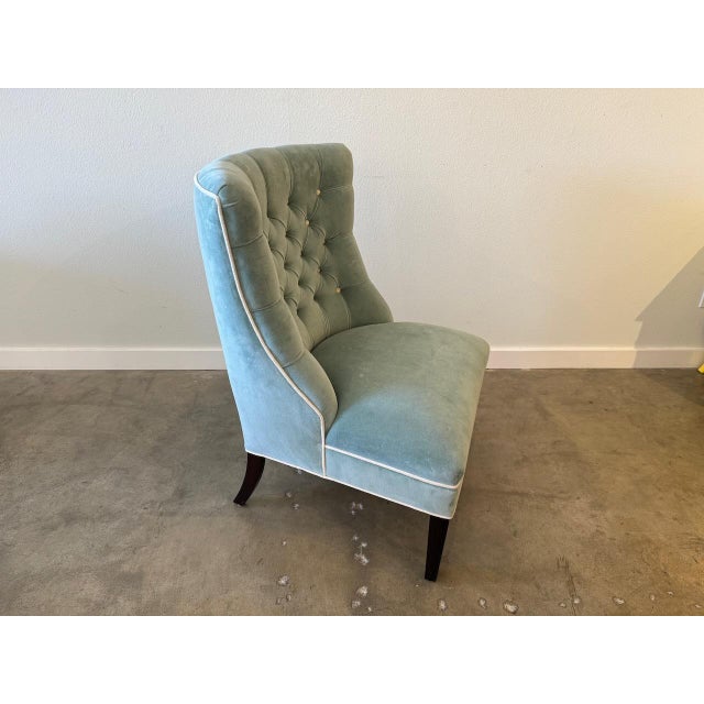 Elegant 1940s blue tufted slipper chair, freshly upholstered in sea foam velvet.