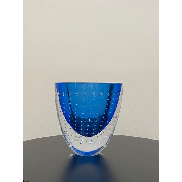 Hand blown controlled bubble studio art glass vase signed by American glass artist Leon Applebaum. The piece features a...
