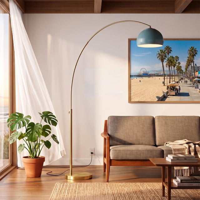 The Half Dome 92" Arc Lamp is a mid-century modern masterpiece featuring a weathered brass steel body and a striking black...