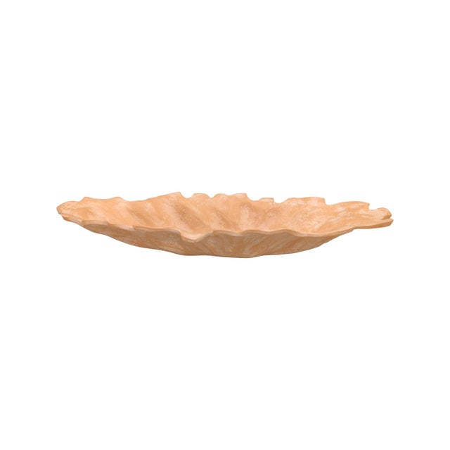 Its gently undulating rim creates a fluid, petal-like silhouette, while the warm terracotta finish with a lightly...