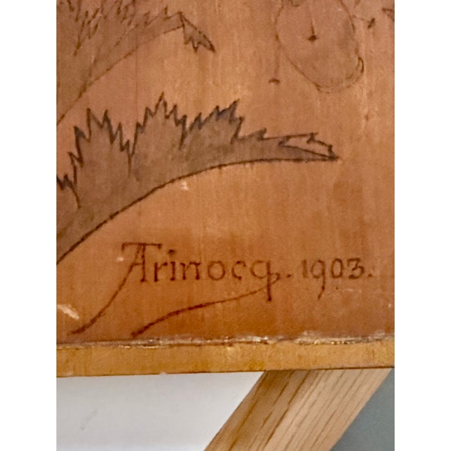 A striking French Art Nouveau pyrographed and hand-painted wood panel by decorative painter Abel Trinocq, signed and dated...