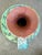 Clay ewer with sgraffito design with blue, green, yellow and red lava glaze. The bottom is stamped “Made in Italy”.
