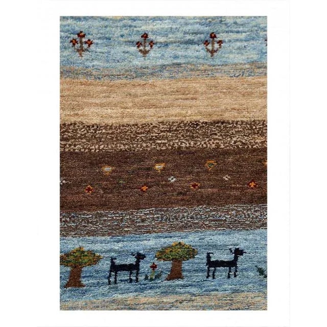 Gabbeh rugs are made by the nomadic Qashqai tribes of southern Iran. They are rough cut and long piled rugs of rich color...