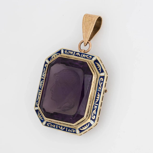 Finely detailed vintage Art Deco era amethyst intaglio pendant crafted in 14k yellow gold (circa 1920s to 1930s). Carved...