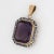 Finely detailed vintage Art Deco era amethyst intaglio pendant crafted in 14k yellow gold (circa 1920s to 1930s). Carved...