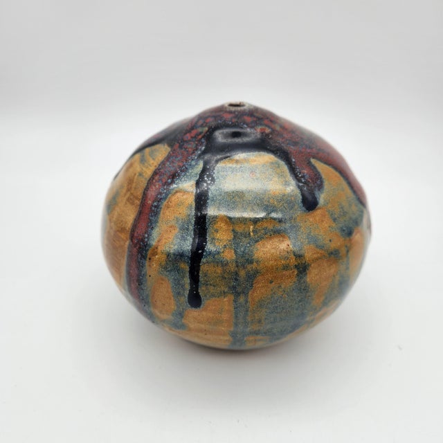 Studio pottery weed pot with layered drip glazes in oxblood, cobalt, and amber over stoneware, signed "Curtis 01