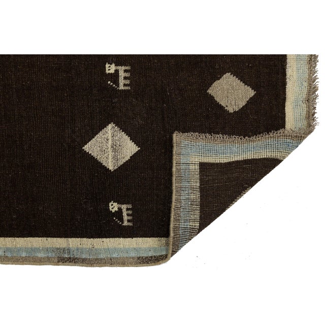 This Gabbeh wool runner combines tribal heritage with modern minimalism. Hand-knotted from high-quality wool, it features...