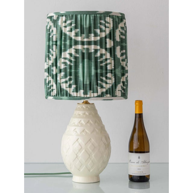 This Art Deco table lamp was handcrafted by Amitābha Studio from an iconic Charles Catteau design for Boch Frères Keramis....