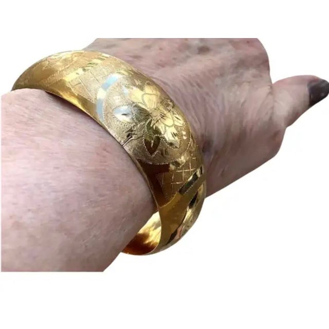 14K Gold Cuff Bracelet. Bracelet features a wide and elegant design with finely hand-etched floral and geometric patterns....