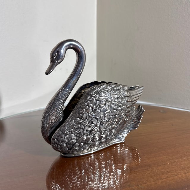 A vintage detailed silver-tone metal swan figurine with an open slot/reservoir back, perfect for use as a table napkin...