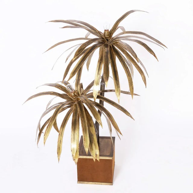 Striking mid-century palm tree sculpture with brutalist style leaves having lights at the tops on faux palm tree trunks in...