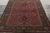 Finely woven in wool, an unusual antique 7x9 Agra rug originating from India circa 1900-1920. Carrying Persian...