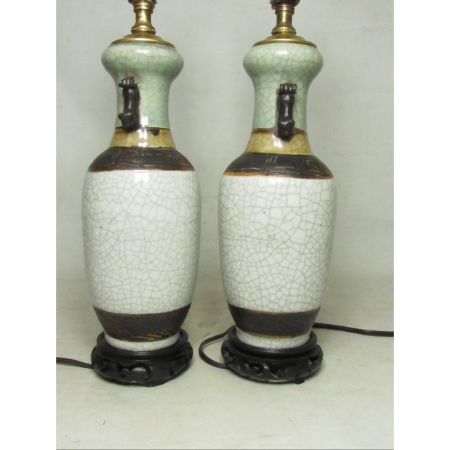 Pair of Chinese crackle glazed, or Guan-ware, porcelain vase lamps, c.1940’s The main body is in an off white crackle...